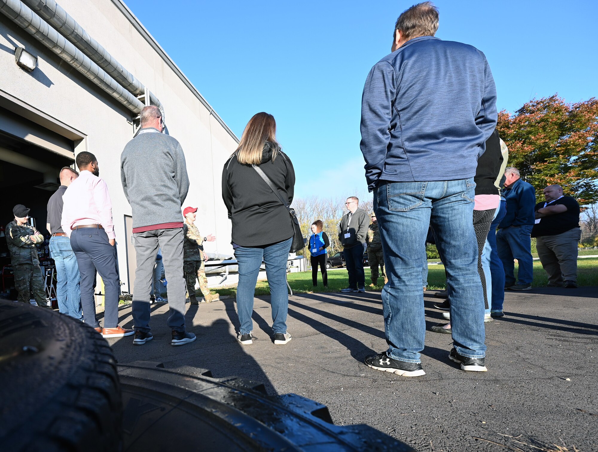 U.S. Air Force Staff Sgt. Jarod Chaidez, 445th Security Forces Squadron combat arms instructor, shows civilian employees of Citizen Airmen some of the weapons SFS utilizes for their mission during Employers Day at Wright-Patterson Air Force Base, Nov. 2, 2024. The 445th SFS was one of many mission sets employees were shown to showcase the wing and Air Force Reserve. (U.S. Air Force photo by Amanda Dick)