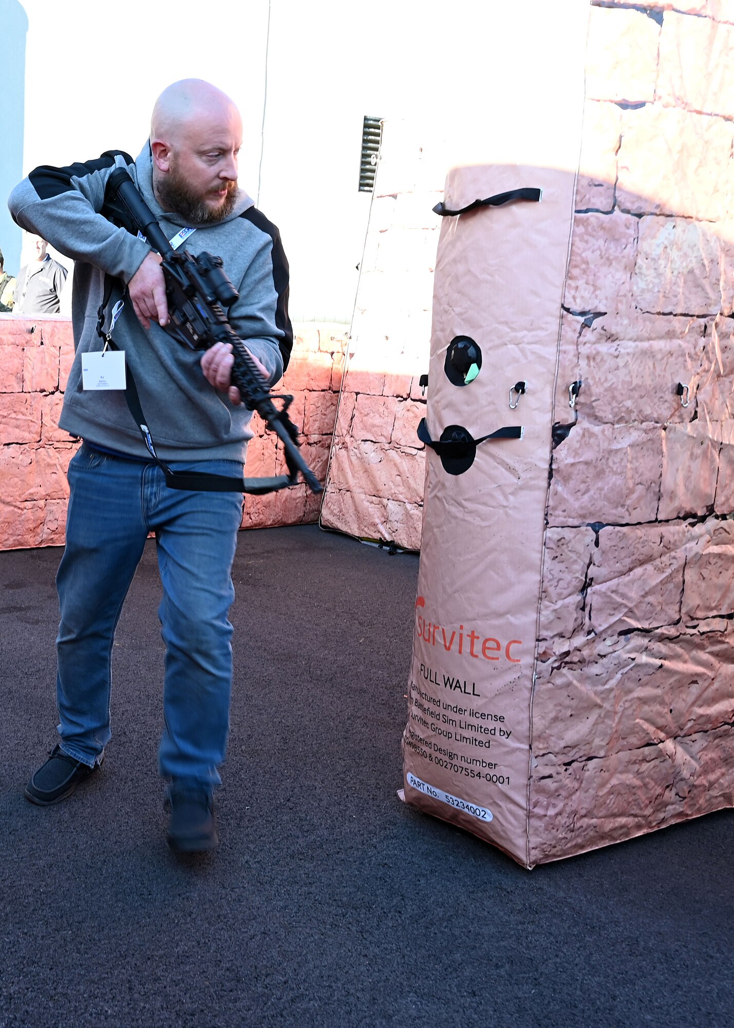 RJ Riehle, employer of U.S. Air Force Senior Master Sgt. Eric Riehle with the 445th Aeromedical Evacuation Squadron, secures a building in a simulated urban environment during Employers Day at Wright-Patterson Air Force Base, Nov. 2, 2024. Civilian employees of Citizen Airmen were able to practice securing a building after being instructed by 445th Security Forces Airman Airmen on proper maneuvers. (U.S. Air Force photo by Amanda Dick)