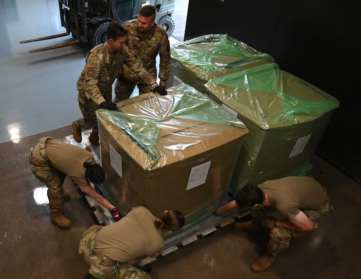 U.S. Air Force Airmen from the 133rd Air Transportation Function move cargo onto a pallet in St. Paul, Minn., Sept. 3, 2024.
