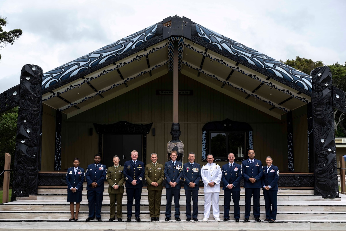 Military members pose for a group photo.