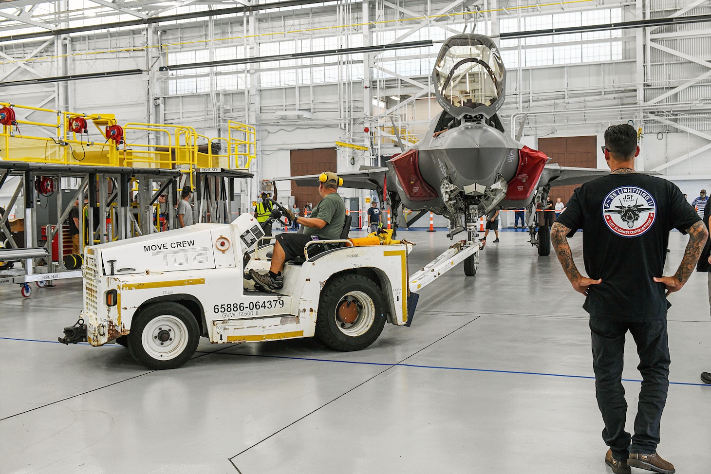 JACKSONVILLE, Fla. (Aug. 08, 2024) Personnel from Fleet Readiness Center Southeast (FRCSE) prepare to park an F-35B Lightning II that was recently delivered from Marine Fighter Attack Squadron 122 at Yuma, Ariz. The jet is the first F-35 ever inducted into the depot and is part of a readiness improvement initiative to support corrosion mitigation efforts for the U.S. Marine Corps (USMC). (U.S. Navy photo by Toiete Jackson/Released)