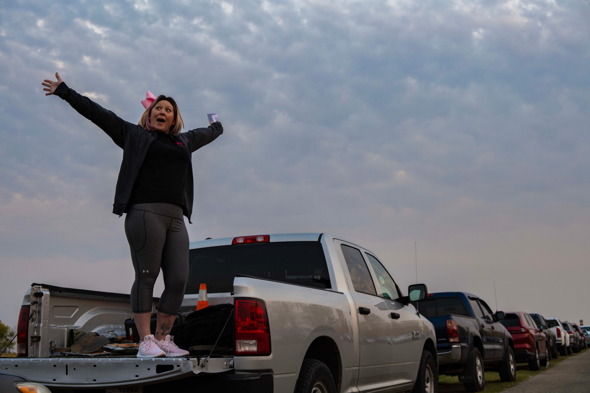 Tech. Sgt. Brandee Hahn, 5th Security Forces Squadron Combat Arms and 5 SFS Armory section chief, delivers a speech before a breast cancer 5k at Minot Air Force Base, North Dakota, Oct. 10, 2024. Hahn hosted a breast cancer 5k to raise awareness and funds. She raised approximately $1,900 for a local foundation, supporting chemotherapy patients. (U.S. Air Force photo by Airman 1st Class Alyssa Bankston)