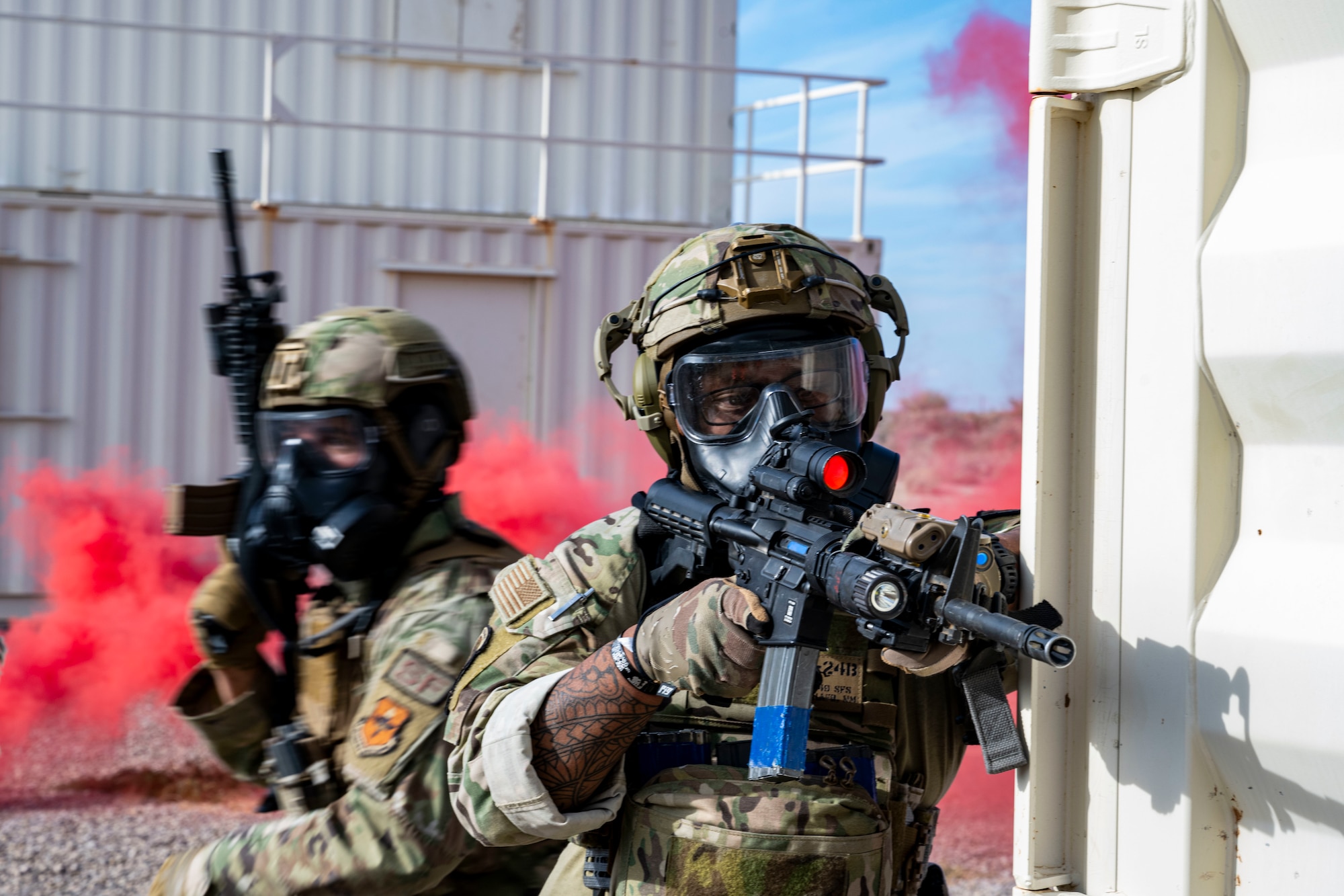 Airmen assigned to the 49th Security Forces Squadron utilize their training to clear buildings during the "Regulator Rodeo " exercise at Holloman Air Force Base, New Mexico, Dec. 3, 2024. Volunteers from around the 49th Wing participated in the exercise as Opposition Forces to provide a "human factor," testing defenders' adaptability and decision-making under dynamic and high-stress scenarios. (U.S. Air Force photo by Senior Airman Isaiah Pedrazzini)
