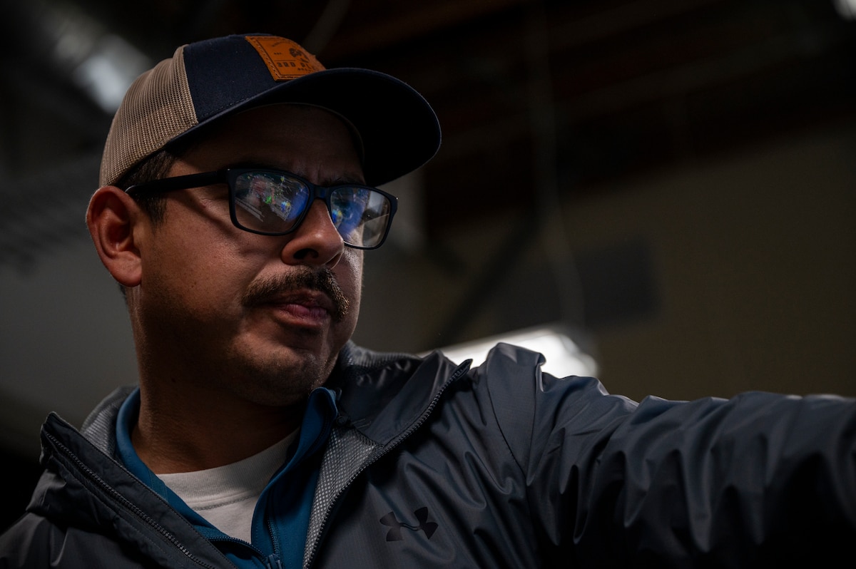 U.S. Air Force Staff Sgt. Dylan Sanchez, 571st Mobility Support Advisory Squadron air advisor, points out a MSAS team on a map during Exercise Sourdough in San Francisco, California, Dec. 4, 2024.
