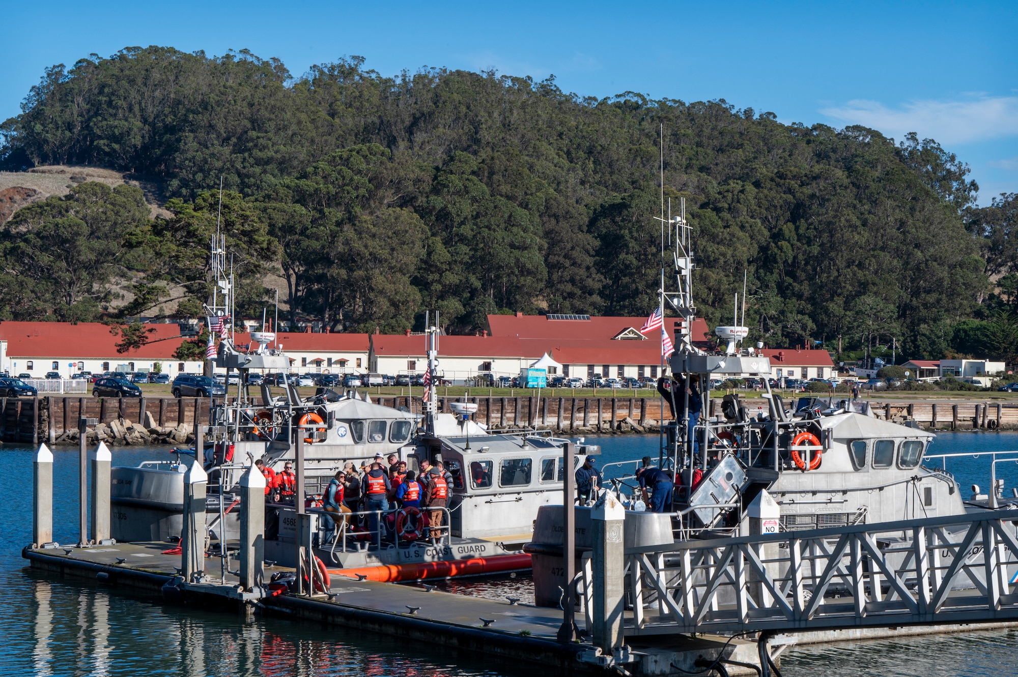The U.S. Coast Guard and U.S. Air Force Airmen with the 571st Mobility Support Advisory Squadron prepare for boat tour of San Francisco, California, Dec. 5, 2024.