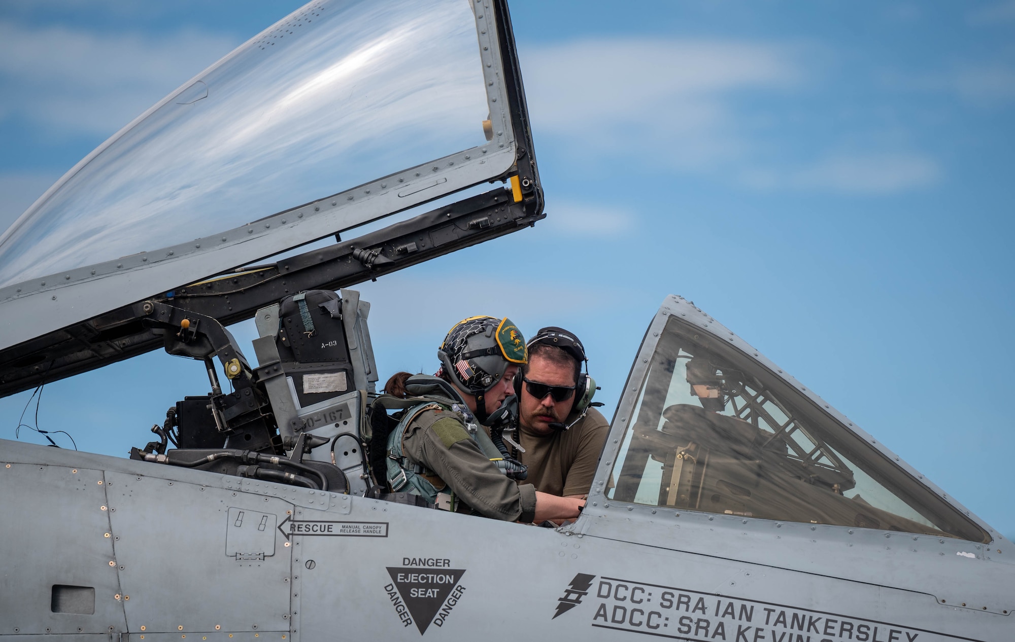 U.S. Air Force Staff Sgt. Charles Durnin, 25th Fighter Generation Squadron dedicated crew chief, communicates with Maj. Erin Crow, 25th Fighter Squadron A-10 pilot, before a flight at Clark Air Base, Philippines, Dec. 14, 2024. The U.S. and Philippine Air Forces are participating in a Dynamic Force Employment exercise, enabling combined and joint force commanders to rapidly deploy forces across the region and to maintain operational readiness, resilience, and operational initiative. (U.S. Air Force photo by Staff Sgt. Christopher Tam)