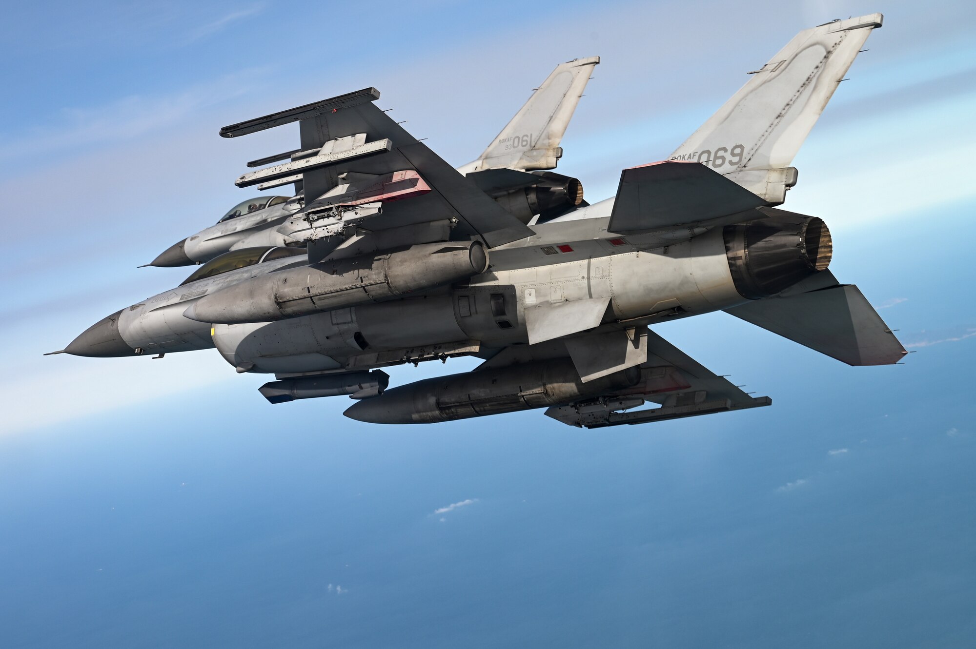 Two Republic of Korea Air Force KF-16 Fighting Falcon aircraft fly in formation
