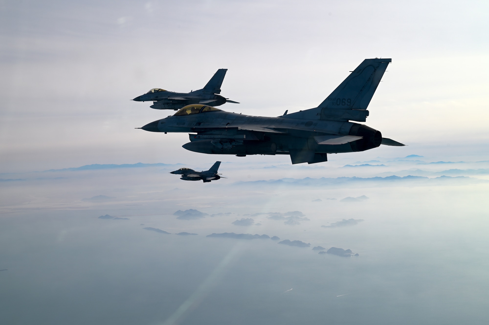 Three Republic of Korea Air Force KF-16 Fighting Falcon aircraft fly in formation