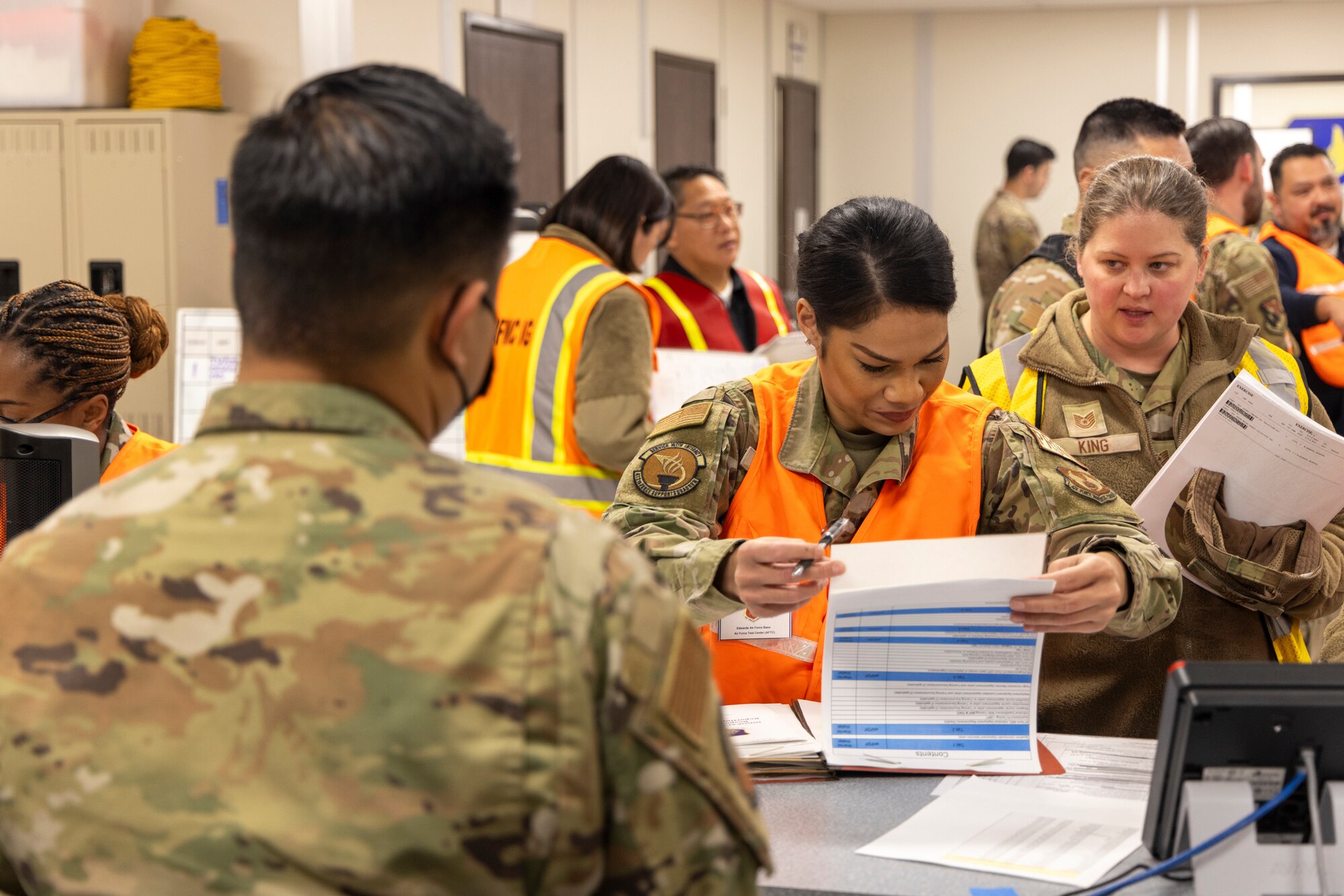 412th Test Wing Airmen proceed through the pre-deployment function line at the 412th Logistics Readiness Squadron during a combat readiness exercise at Edwards Air Force Base, California, Dec. 6. (Air Force photo by Daniel Kelley)