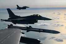 F-16s fly in formation