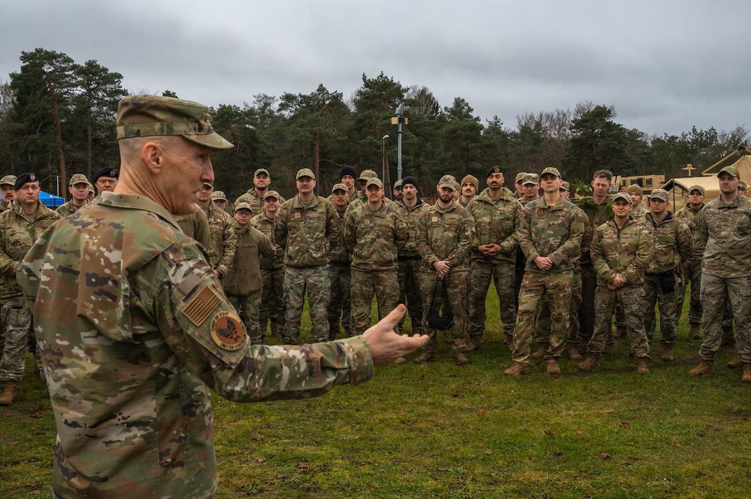 Military members are briefed by leadership.