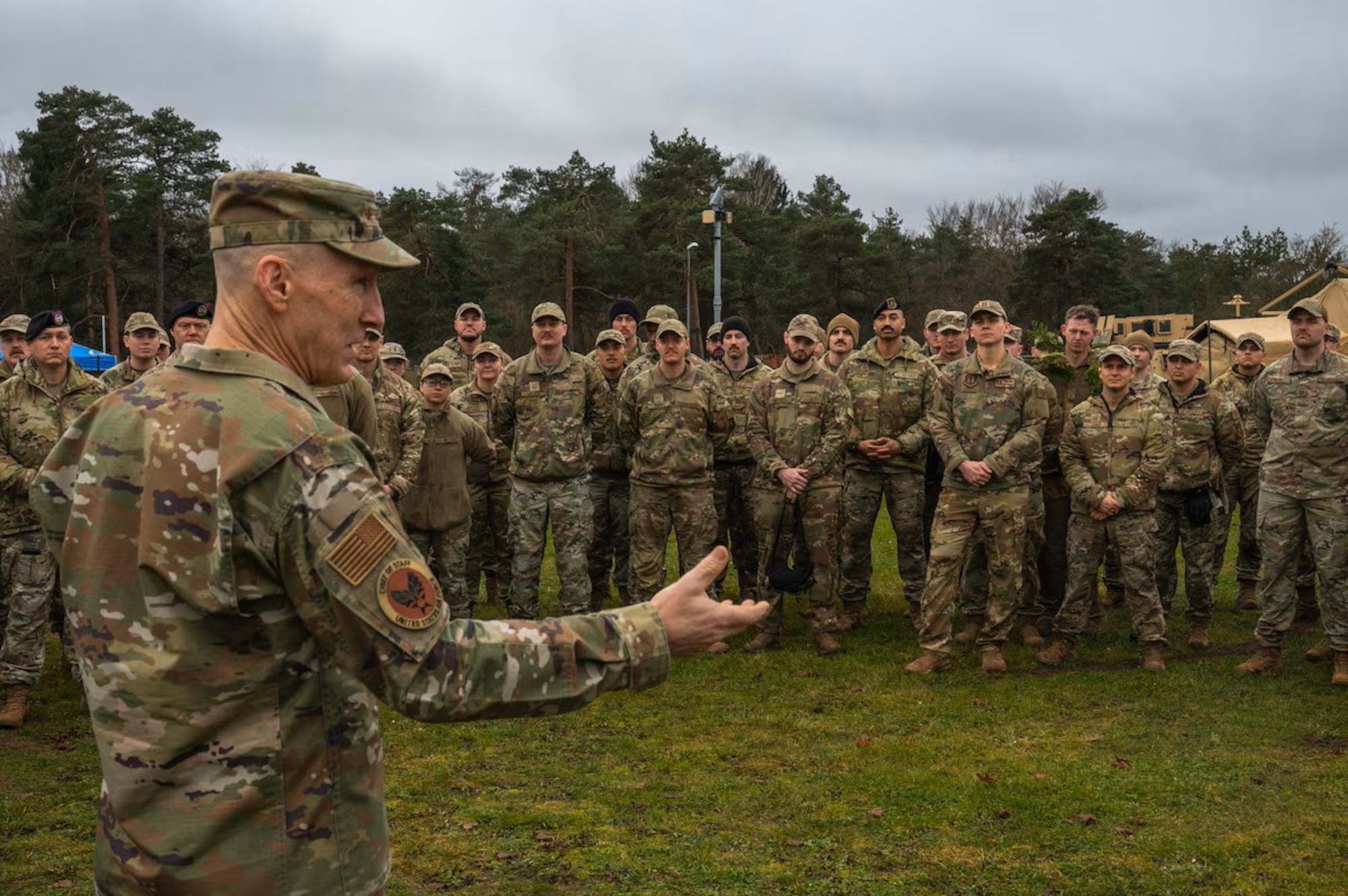Military members are briefed by leadership.