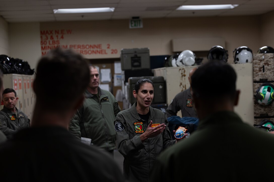 U.S. Marine Corps Lt. Col. Jasmin Moghbeli, a New York native and NASA astronaut, talks to Marines with Marine Light Attack Helicopter Squadron (HMLA) 367, Marine Aircraft Group 39, 3rd Marine Aircraft Wing before flying an AH-1Z Viper at Marine Corps Base Camp Pendleton, Dec. 12, 2024. A former AH-1W Super Cobra pilot with HMLA-367 and Marine Corps test pilot, Moghbeli flew more than 150 combat missions before joining NASA’s Astronaut Corps. She commanded SpaceX Crew-7, spending 199 days in orbit and aboard the International Space Station contributing to experiments and technology demonstrations. (U.S. Marine Corps photo by Lance Cpl. Samantha Devine)