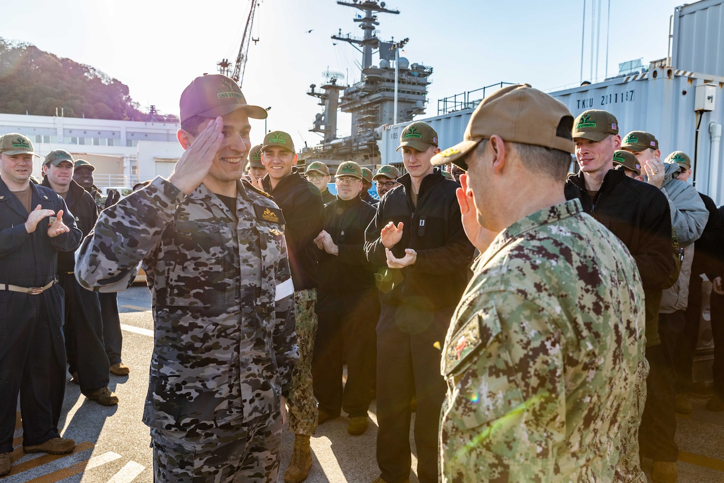YOKOSUKA, Japan (Dec. 12, 2024) – Rear Adm. Chris Cavanaugh, commander, Submarine Group 7, salutes Royal Australian Navy Lt. Cmdr. James after pinning a U.S. Navy Submarine Warfare Device during pier-side quarters for the Virginia-class fast-attack submarine USS Vermont (SSN 792) at Commander, Fleet Activities Yokosuka, Dec. 12. Vermont is on deployment supporting the U.S. 7th Fleet, the U.S. Navy’s largest forward-deployed numbered fleet, operating with allies and partners in preserving a free and open Indo-Pacific region (U.S. Navy photo by Mass Communication Specialist 2nd Class Daniel G. Providakes) (This photo has been altered and last name per Royal Australian Navy protocols)