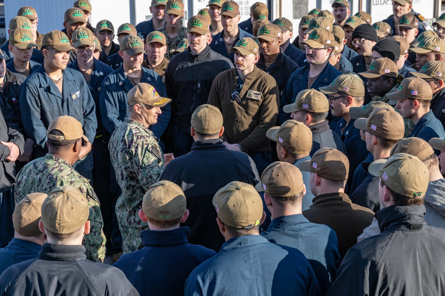 YOKOSUKA, Japan (Dec. 12, 2024) – Rear Adm. Chris Cavanaugh, commander, Submarine Group 7, addresses the crew of the Virginia-class fast-attack submarine USS Vermont (SSN 792) during pier-side quarters at Commander, Fleet Activities Yokosuka, Dec. 12. Vermont is on deployment supporting the U.S. 7th Fleet, the U.S. Navy’s largest forward-deployed numbered fleet, operating with allies and partners in preserving a free and open Indo-Pacific region (U.S. Navy photo by Mass Communication Specialist 2nd Class Daniel G. Providakes) (This photo has been altered and last name withheld per Royal Australian Navy protocols.)