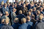 YOKOSUKA, Japan (Dec. 12, 2024) – Rear Adm. Chris Cavanaugh, commander, Submarine Group 7, addresses the crew of the Virginia-class fast-attack submarine USS Vermont (SSN 792) during pier-side quarters at Commander, Fleet Activities Yokosuka, Dec. 12. Vermont is on deployment supporting the U.S. 7th Fleet, the U.S. Navy’s largest forward-deployed numbered fleet, operating with allies and partners in preserving a free and open Indo-Pacific region (U.S. Navy photo by Mass Communication Specialist 2nd Class Daniel G. Providakes) (This photo has been altered and last name withheld per Royal Australian Navy protocols.)