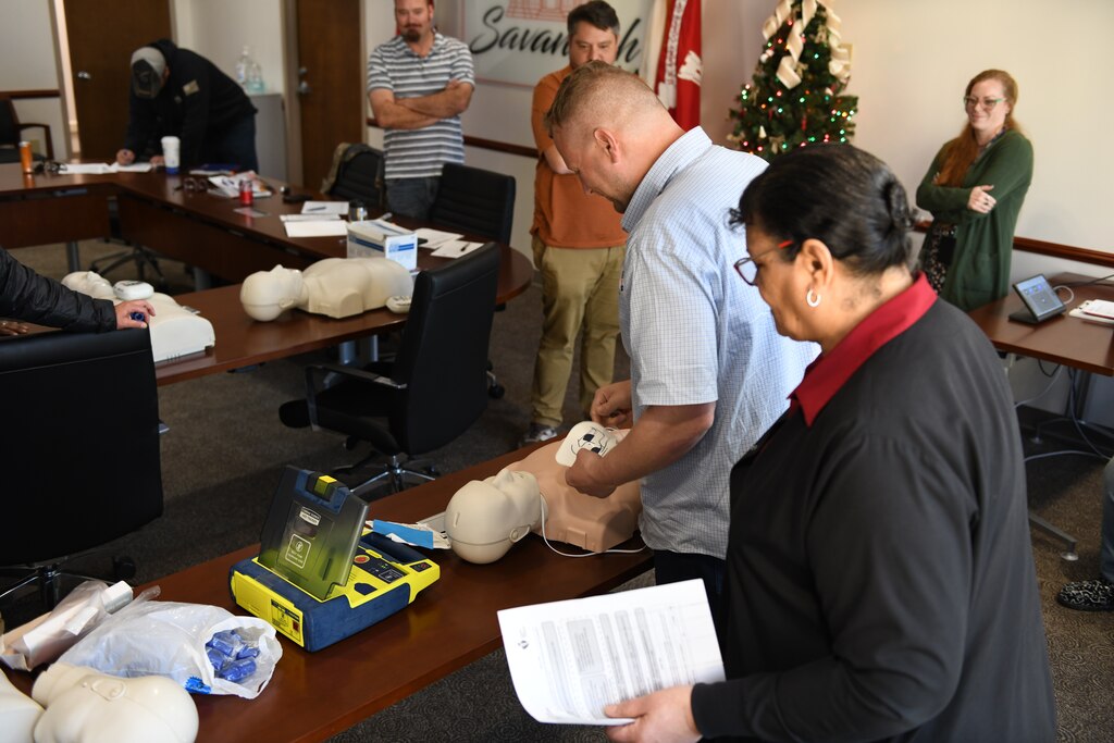 Diane Barbour (right), the Occupational Health Nurse for the U.S. Army Corps of Engineers, Savannah District, instructs an employee from the Hazardous, Toxic and Radioactive Waste Branch how to apply automated external defibrillators patches to a mannequin during a certification course in Savannah, Georgia, Dec. 16, 2024. Participants were guided through the steps of turning on the AED device, applying pads, and following the machine’s prompts.