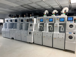 A bank of machines in a clean room inside a microcircuit foundry.