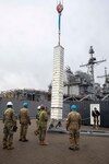 Sailors from the Ticonderoga-class guided-missile cruiser USS Gettysburg (CG 64), Navy Cargo Handling Battalion (NCHB) 10, and members of the Royal Danish Navy participate in an ammunition transfer evolution during the NATO-led maritime vigilance activity Neptune Strike.