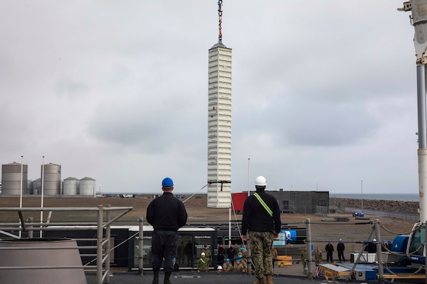 Sailor from the Ticonderoga-class guided-missile cruiser USS Gettysburg (CG 64), Navy Cargo Handling Battalion (NCHB) 10, and members of the Royal Danish Navy participate in an ammunition transfer evolution during the NATO-led maritime vigilance activity Neptune Strike.