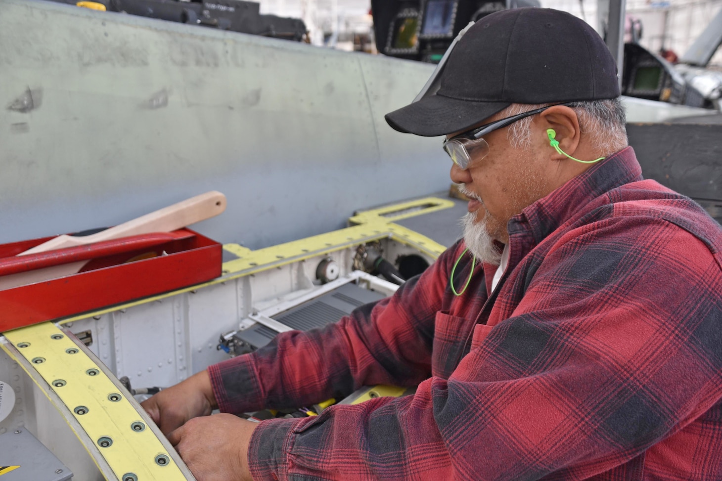 Aircraft electrician Orlando Irwin rewires the leading edge extension wing harness on an F/A-18 Super Hornet at NAS North Island, Coronado, California.