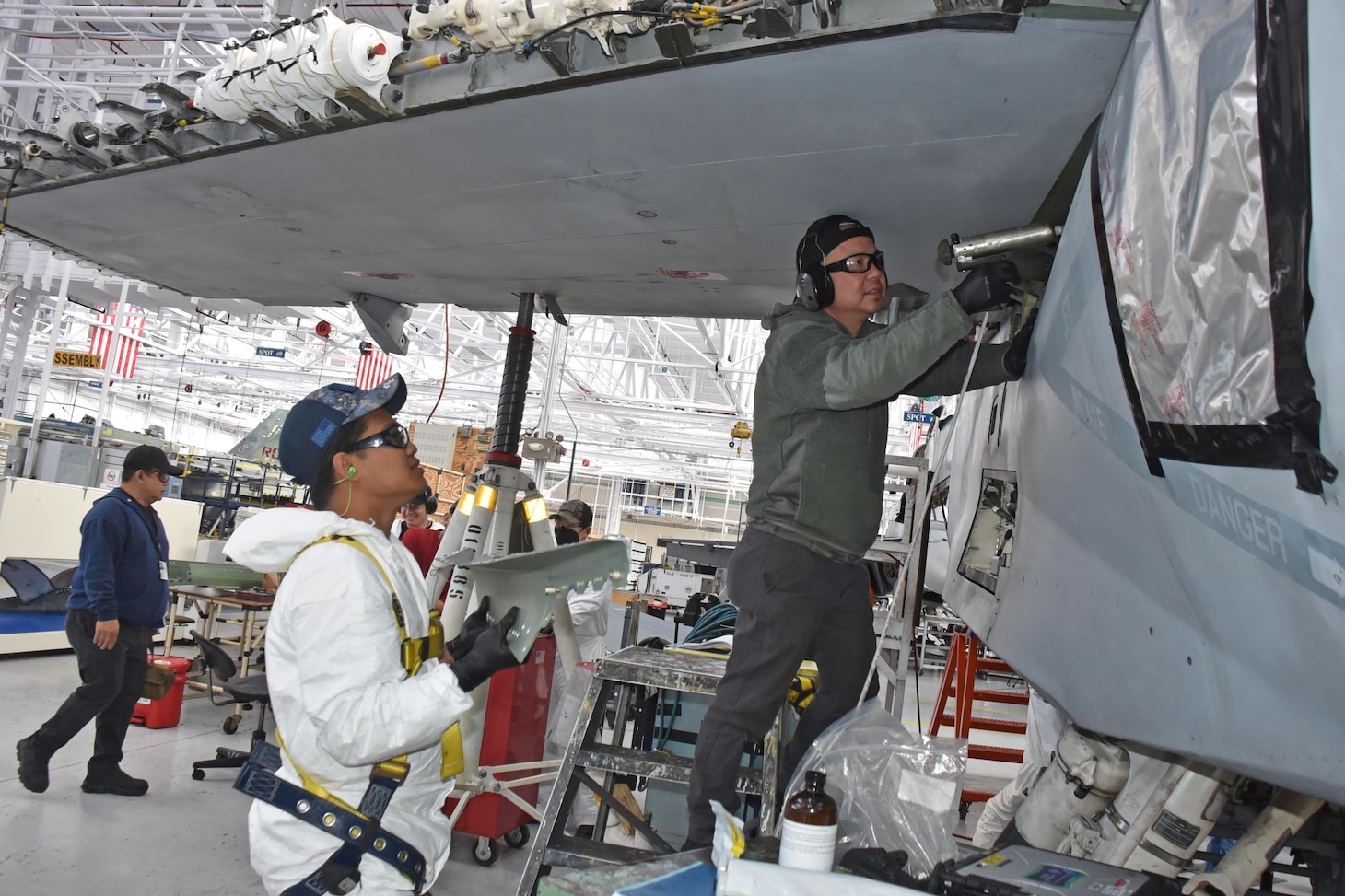 Aircraft mechanics Jaaziel Juego and Dang Nguyen install a drag load onto an F/A-18 Super Hornet at Naval Air Station North Island, Coronado, California. FRCSW is the leading maintenance, repair and overhaul depot on the West Coast providing premiere quality workmanship in support of our warfighters.