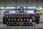 The 31 students graduating from the U.S. Naval Test Pilot School Class 165 pose for a group photo at Naval Air Station Patuxent River in Maryland.