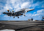 An F/A-18 F Super Hornet aircraft, assigned to Strike Fighter Squadron (VFA) 103, approaches the flight deck of the aircraft carrier USS George H.W. Bush (CVN 77). George H.W. Bush provides the national command authority flexible, tailorable war fighting capability through the carrier strike group that maintains maritime stability and security in order to ensure access, deter aggression and defend U.S., allied and partner interests.