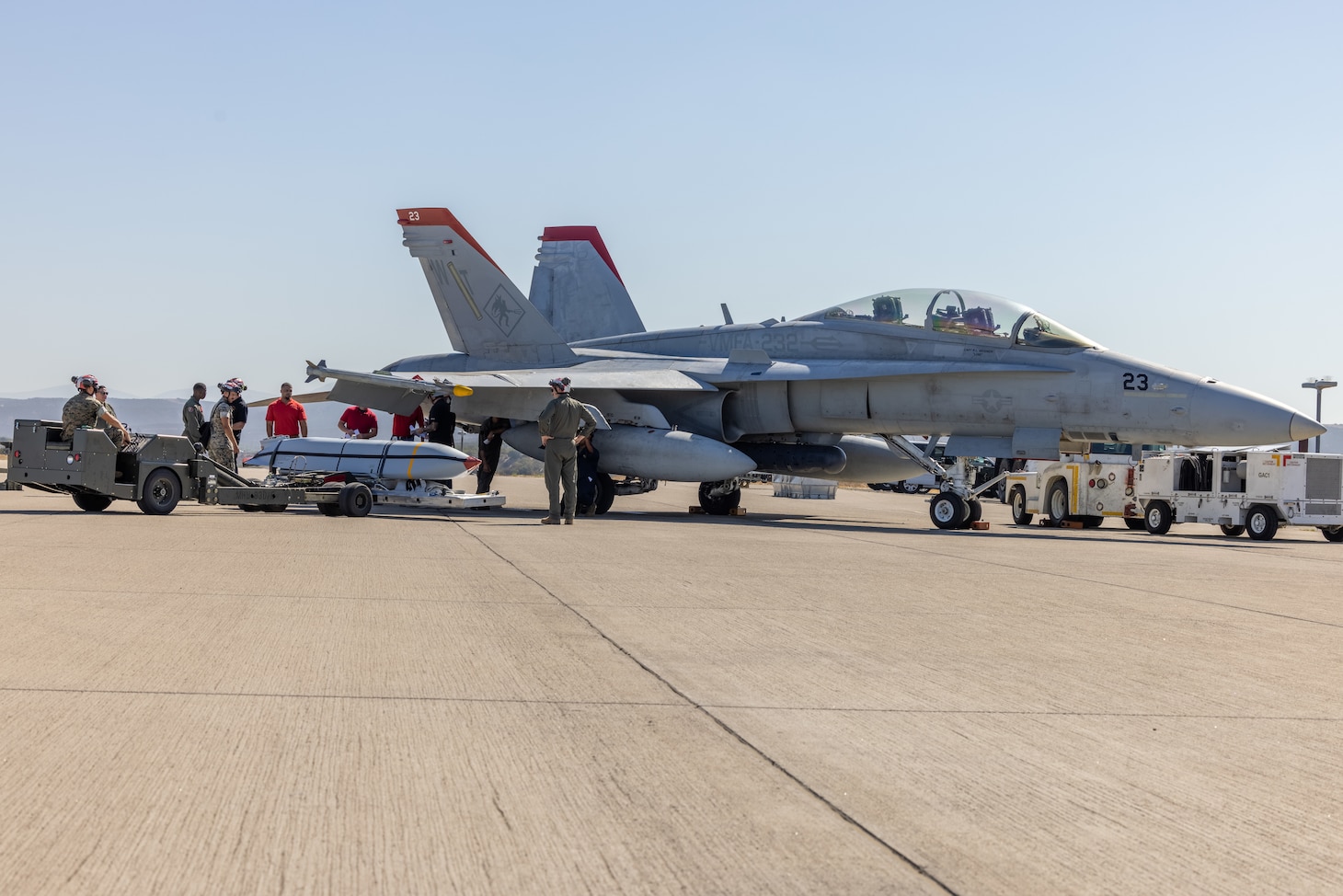 U.S. Marines with Marine Fighter Attack Squadron (VMFA) 232, Marine Aircraft Group 11, 3rd Marine Aircraft Wing, and Marine Aviation Logistics Squadron 11, MAG-11, load an AGM-158A joint air-to-surface standoff missile on an F/A-18 Hornet assigned to VMFA-232 during the AGM-158A validation and verification at Marine Corps Air Station Miramar, California, Aug. 27. MALS-11 and VMFA-232 were the first Marine Corps units to conduct ordnance operations with the AGM-158A JASSM which is being incorporated into the F/A-18 Hornet ordnance arsenal.