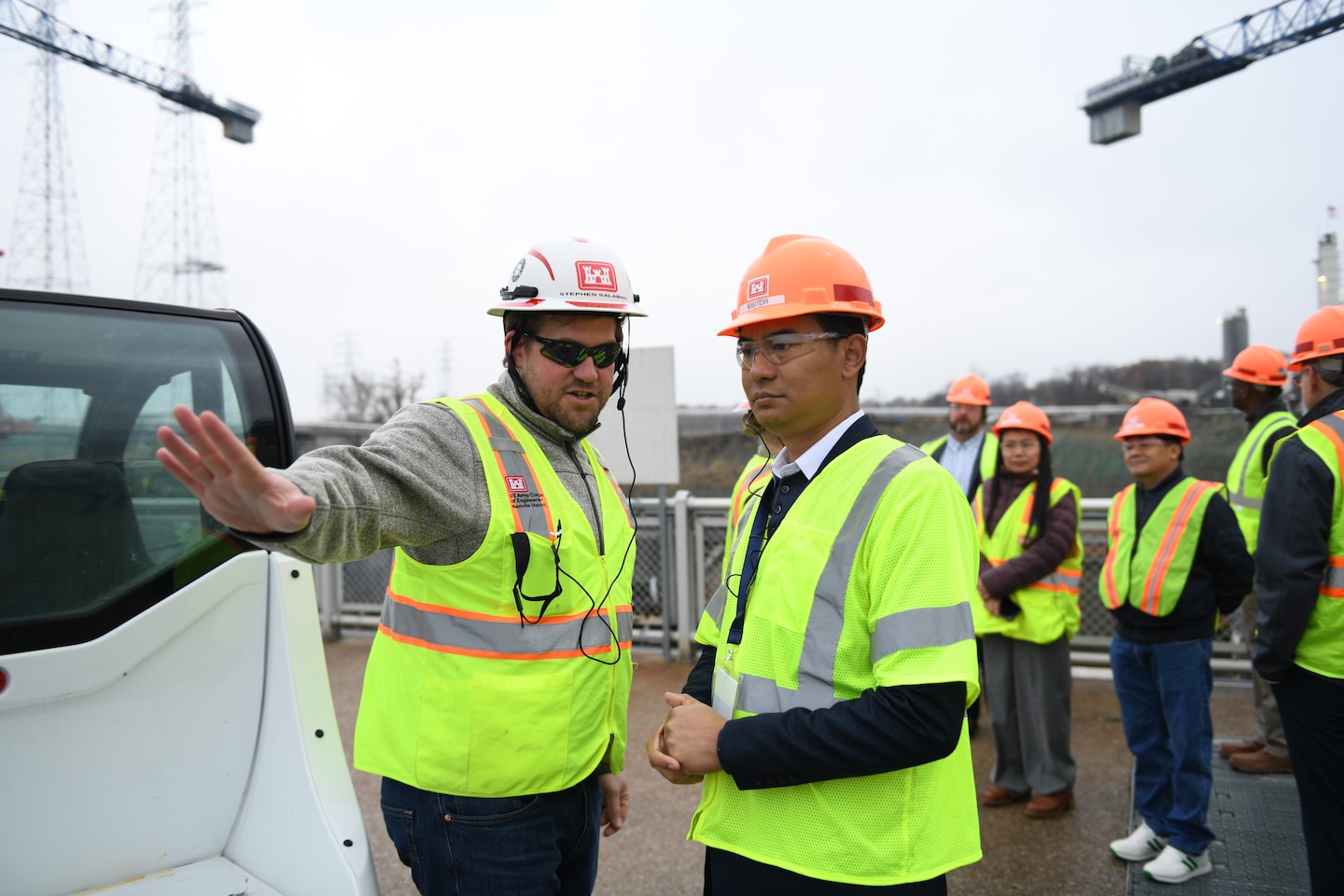 Stephen Salaman (Left), tech lead for the U.S. Army Corps of Engineers Nashville District explains operation processes during the Mekong River Commission and the Mississippi River Commission site visit to Kentucky Lock Dec. 10, 2024, on the Tennessee River in Grand Rivers, Kentucky. The Mekong River Commission and Mississippi River Commission met to strengthen international collaboration for sustainable management of water resources. Topics included management of population water resource needs, navigation, hydropower, environmental planning, flood risk management, and natural based solutions. The Sister Rivers Partnership Exchange supports the Mekong-U.S. Partnership (MUSP).