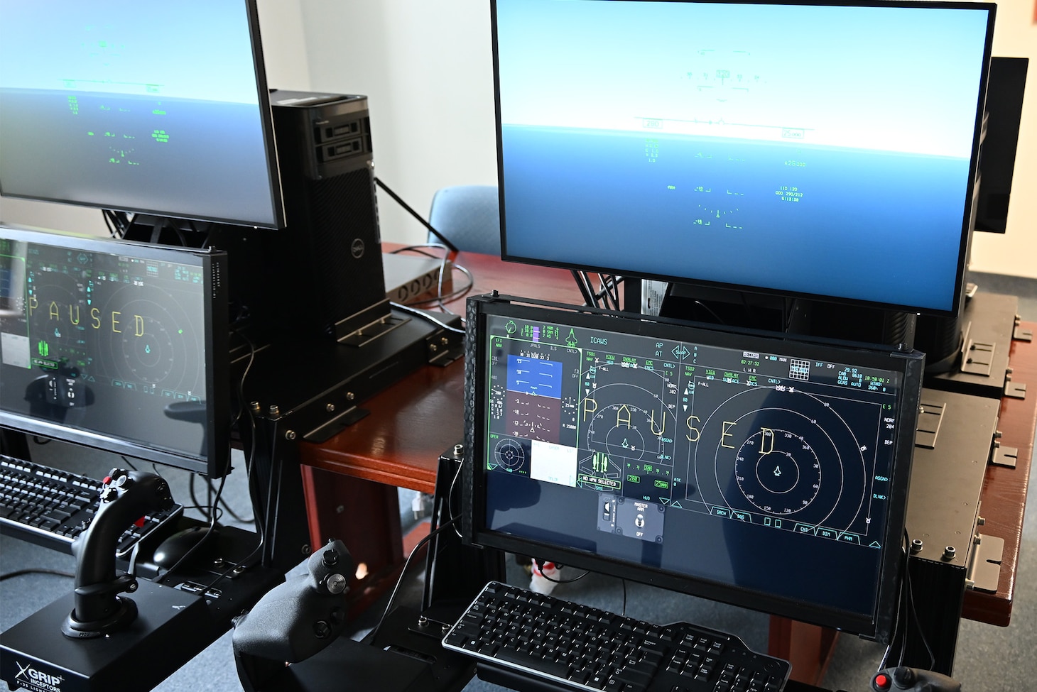 Desktop trainers display Naval Aviation’s new carrier-based joint air training program in a lab at the Naval Air Warfare Center Aircraft Division near its Patuxent River, Maryland headquarters on July 31.