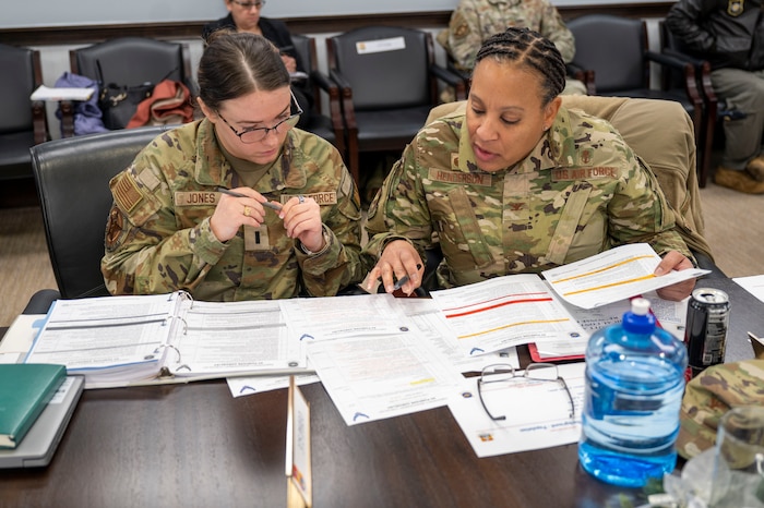 The 375th Air Mobility Wing conducted a tabletop Public Emergency Exercise with Scott Air Force Base mission partners on Dec. 13, 2024. This simulated emergency included representatives from United States Transportation Command, Surface Deployment & Distribution Command, Defense Information System Agency, Defense Information Technology Contracting Organization, the 126th Air Refueling Wing, the 932nd Airlift Wing and the St. Clair County Health Department. (U.S. Air Force photo by Rachel Sansano)