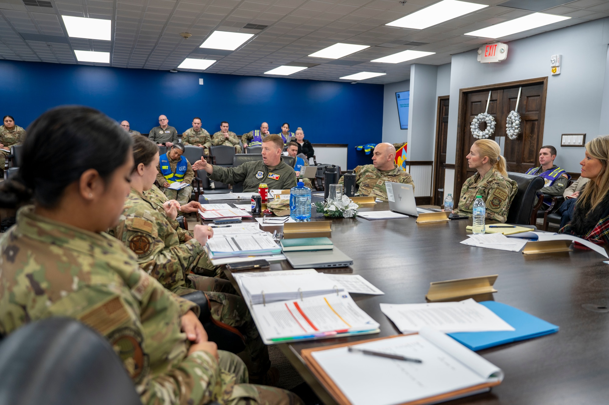 Col. John Poole, 375th Air Mobility Wing Commander, speaks during a tabletop Public Emergency Exercise on Dec. 13, 2024. The exercise aimed to identify potential gaps in existing response plans, improve interagency collaboration, and ensure all participants clearly understand their roles in a public health crisis. (U.S. Air Force photo by Rachel Sansano)
