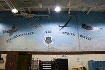 A mural painted in the 9th Maintenance Squadron’s egress systems shop depicts the evolution of reconnaissance aircraft at Beale Air Force Base, Dec. 2, 2024.
