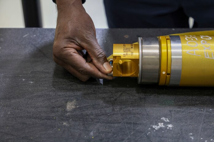 Charlie Toomer, 9th Maintenance Squadron egress systems craftsman, applies a restraining pin to the egress machinery that causes the thrust during a pilot’s ejection from an aircraft at Beale Air Force Base, Dec. 2, 2024.