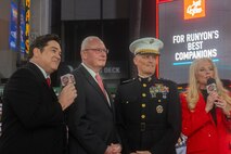 Hollywood Christmas Parade hosts Dean Cain and Laura McKenzie introduce retired U.S. Marine Corps Lt. Gen. James Laster, president and CEO of the Toys for Tots Foundation, and U.S. Marine Corps Lt. Gen. Leonard Anderson, commander of U.S. Marine Corps Forces Reserve and U.S. Marine Corps Forces South, during the 92nd Hollywood Christmas Parade in Hollywood, California, Dec. 1, 2024. The mission of the Toys for Tots Holiday Program is to collect new, unwrapped toys, books, and other gifts and distribute them to less fortunate children at Christmastime. The Hollywood Christmas Parade is an annual American parade held on the Sunday after Thanksgiving in Hollywood; it follows a 3.5-mile route along Hollywood Boulevard, then back along Sunset Boulevard, featuring various celebrities. (U.S. Marine Corps photo by Cpl. Fred Garcia)
