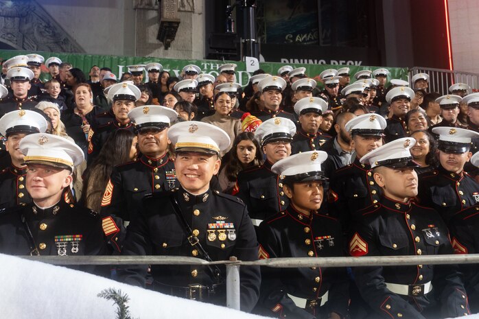 U.S. Marines await the start of the 92nd Hollywood Christmas Parade in Hollywood, California, Dec. 1, 2024. The mission of the Toys for Tots Holiday Program is to collect new, unwrapped toys, books, and other gifts and distribute them to less fortunate children at Christmastime. The Hollywood Christmas Parade is an annual American parade held on the Sunday after Thanksgiving in Hollywood; it follows a 3.5-mile route along Hollywood Boulevard, then back along Sunset Boulevard, featuring various celebrities. (U.S. Marine Corps photo by Cpl. Fred Garcia)