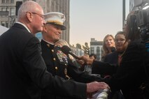 Retired U.S. Marine Corps Lt. Gen. James Laster, president and CEO of the Toys for Tots Foundation, and U.S. Marine Corps Lt. Gen. Leonard Anderson, commander of U.S. Marine Corps Forces Reserve and U.S. Marine Corps Forces South, conduct interviews with local media outlets during the 92nd Hollywood Christmas Parade in Hollywood, California, Dec. 1, 2024. The mission of the Toys for Tots Holiday Program is to collect new, unwrapped toys, books, and other gifts and distribute them to less fortunate children at Christmastime. The Hollywood Christmas Parade is an annual American parade held on the Sunday after Thanksgiving in Hollywood; it follows a 3.5-mile route along Hollywood Boulevard, then back along Sunset Boulevard, featuring various celebrities. (U.S. Marine Corps photo by Cpl. Fred Garcia)