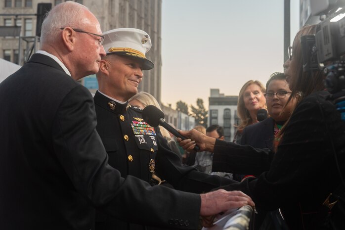 Retired U.S. Marine Corps Lt. Gen. James Laster, president and CEO of the Toys for Tots Foundation, and U.S. Marine Corps Lt. Gen. Leonard Anderson, commander of U.S. Marine Corps Forces Reserve and U.S. Marine Corps Forces South, conduct interviews with local media outlets during the 92nd Hollywood Christmas Parade in Hollywood, California, Dec. 1, 2024. The mission of the Toys for Tots Holiday Program is to collect new, unwrapped toys, books, and other gifts and distribute them to less fortunate children at Christmastime. The Hollywood Christmas Parade is an annual American parade held on the Sunday after Thanksgiving in Hollywood; it follows a 3.5-mile route along Hollywood Boulevard, then back along Sunset Boulevard, featuring various celebrities. (U.S. Marine Corps photo by Cpl. Fred Garcia)