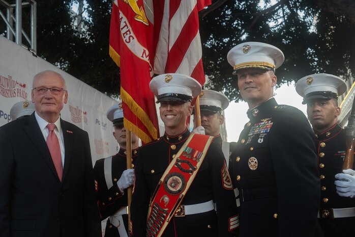 Retired and active duty U.S. Marines walk the red carpet during the 92nd Hollywood Christmas Parade in Hollywood, California, Dec. 1, 2024. The mission of the Toys for Tots Holiday Program is to collect new, unwrapped toys, books, and other gifts and distribute them to less fortunate children at Christmastime. The Hollywood Christmas Parade is an annual American parade held on the Sunday after Thanksgiving in Hollywood; it follows a 3.5-mile route along Hollywood Boulevard, then back along Sunset Boulevard, featuring various celebrities. (U.S. Marine Corps photo by Cpl. Fred Garcia)
