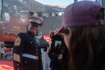 U.S. Marine Corps Sgt. Maj. Joshua Minter, inspector-instructor command senior enlisted leader with 2nd Battalion, 23rd Marine Regiment, engages with attendees of the 92nd Hollywood Christmas Parade in Hollywood, California, Dec. 1, 2024. The mission of the Toys for Tots Holiday Program is to collect new, unwrapped toys, books, and other gifts and distribute them to less fortunate children at Christmastime. The Hollywood Christmas Parade is an annual American parade held on the Sunday after Thanksgiving in Hollywood; it follows a 3.5-mile route along Hollywood Boulevard, then back along Sunset Boulevard, featuring various celebrities. (U.S. Marine Corps photo by Cpl. Fred Garcia)