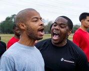 U.S. Marine Corps Staff Sgt. Raymond Cleveland, right, the staff non-commissioned officer in charge of Recruiting Sub Station Beaumont, Recruiting Station Houston, demonstrates how to request to mount a pull-up bar to Keith Vallair, a guest, during an initial strength test at Gulf Terrace Park in Beaumont, Texas, Dec. 14, 2024. Poolees and guests with RSS Beaumont were evaluated on their pull-ups, ammo can lifts, plank, and 1.5-mile run in order to prepare them for recruit training. (U.S. Marine Corps photo by Sgt. Ryan H. Pulliam)