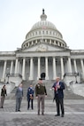 A soldier and civilian discuss plans for pass in review outside of the U.S. Capitol