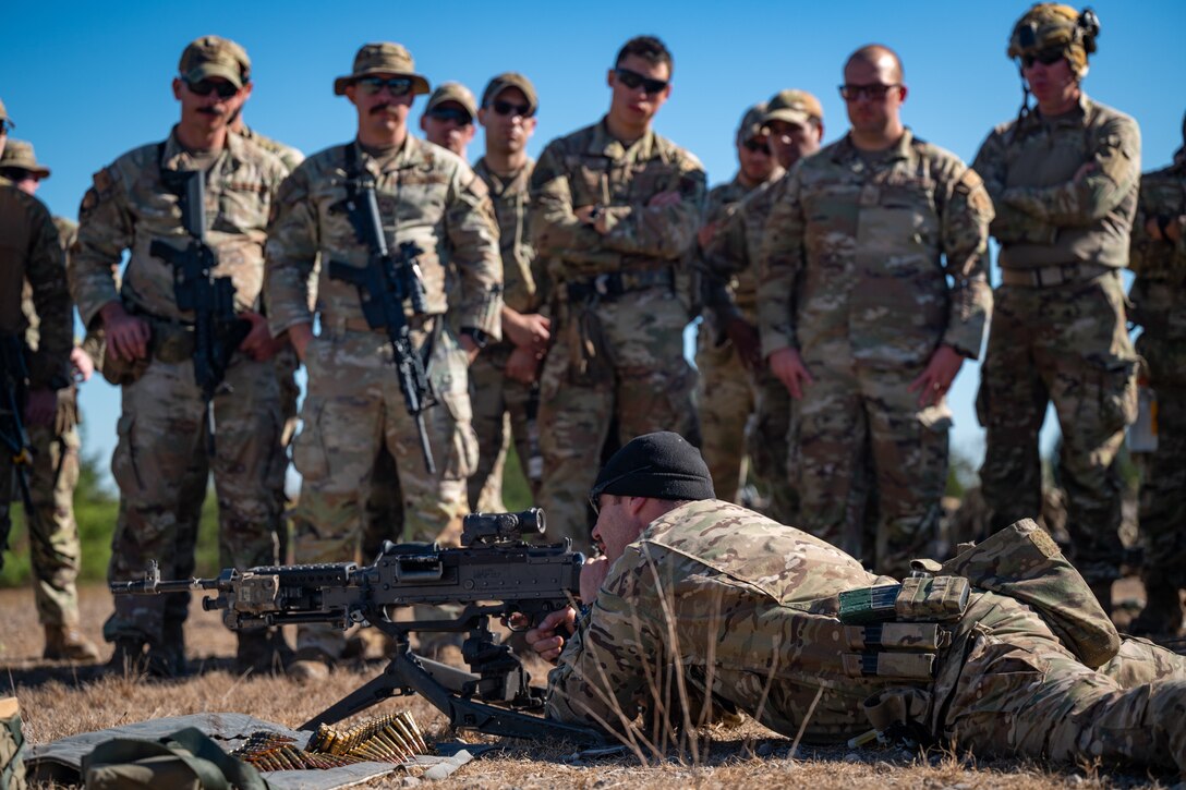 A U.S. Soldier assigned to the 2nd Battalion, 5th Special Forces Group (Airborne), conducts an M240 and M249 machine gun safety and operations brief for U.S. Air Force Security Forces Airmen with the Air National Guard (ANG) at Saint Vith Range during exercise Sage Eagle 25-1 at Fort Knox, Kentucky, Oct. 20, 2024. As part of their validation requirements, U.S. Army Green Berets trained ANG Defenders as their partner force in mission execution in evolving contested environments. (U.S. Air National Guard photo by Tech. Sgt. Sarah M. McClanahan)