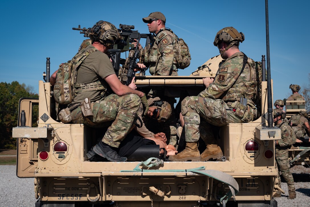 U.S. Air Force Security Forces Airmen with the Air National Guard and a U.S. Soldiers assigned to the 2nd Battalion, 5th Special Forces Group (5SFG) (Airborne), transport a simulated patient of a mass casualty incident on a Humvee assigned to the 5SFG during a mass casualty training inject at Fort Knox, Kentucky, Oct. 23, 2024. This training was a component of exercise Sage Eagle 25-1, a recurring, battalion-sized, unconventional warfare exercise that validates Special Forces’ ability to operate in uncertain environments while training and incorporating conventional forces into an evolving contested environment. (U.S. Air National Guard photo by Tech. Sgt. Sarah M. McClanahan)