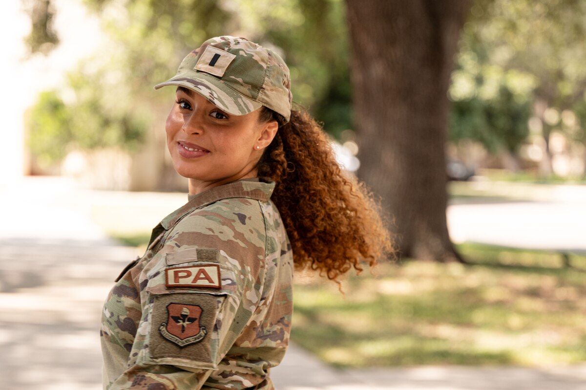 Military woman poses for photo.