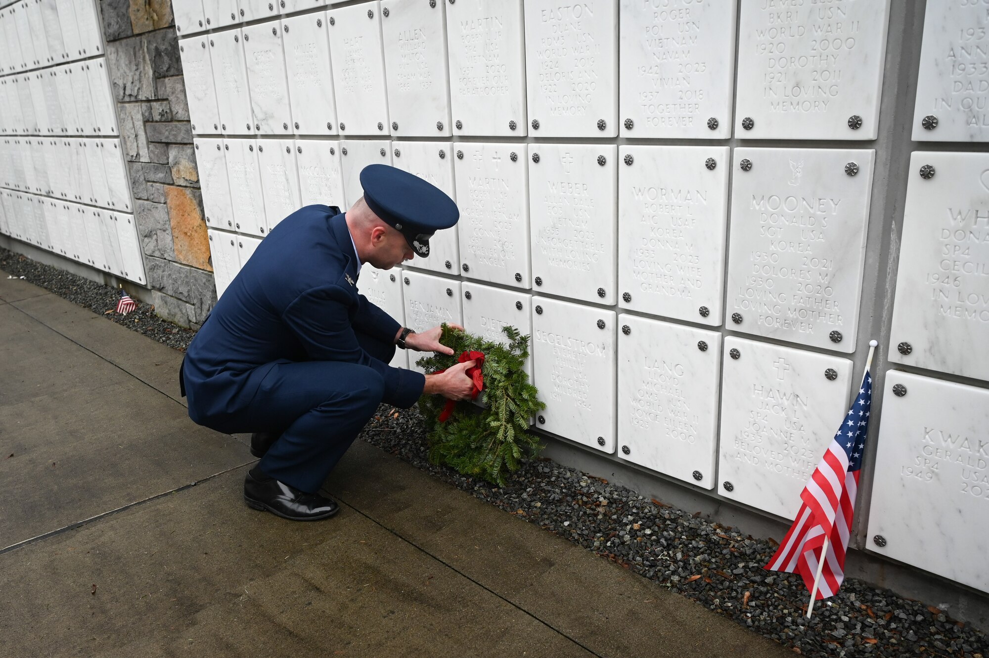 Wreath laying on head stone.