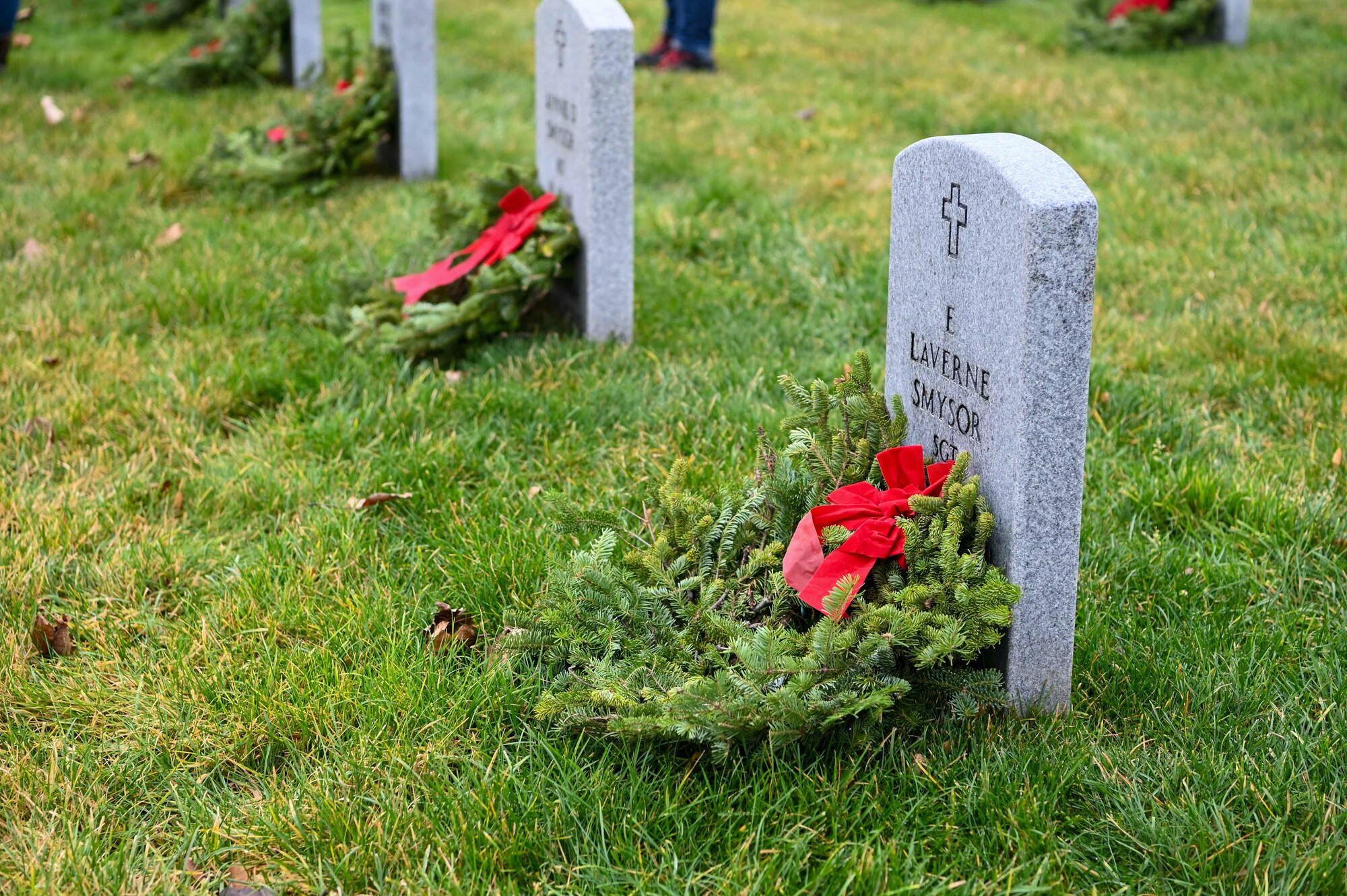 Wreath laying on head stone.