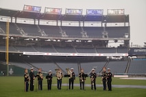 service members throwing a ball