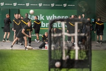 service members throwing a ball